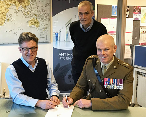 BioClad Managing Director Lindsay McKenzie signing the Armed Forces Covenant